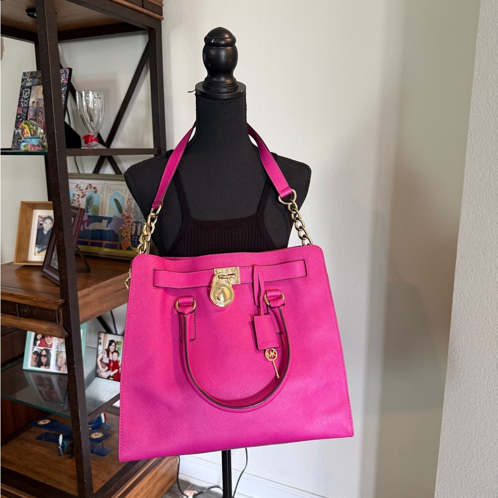 Large Michael Kors Fuchsia Tote with Gold Accents. Very good condition. Like new